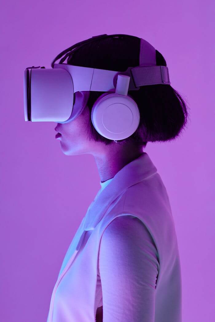 ours-journey Side profile of a woman wearing VR goggles in a studio with purple lighting, embodying future tech.